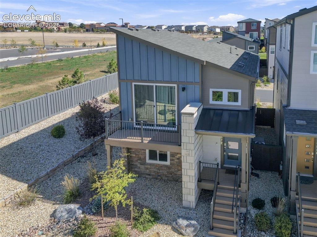 Image 30 of 34: Contemporary exterior featuring a shed roofline, vertical board-and-batten 