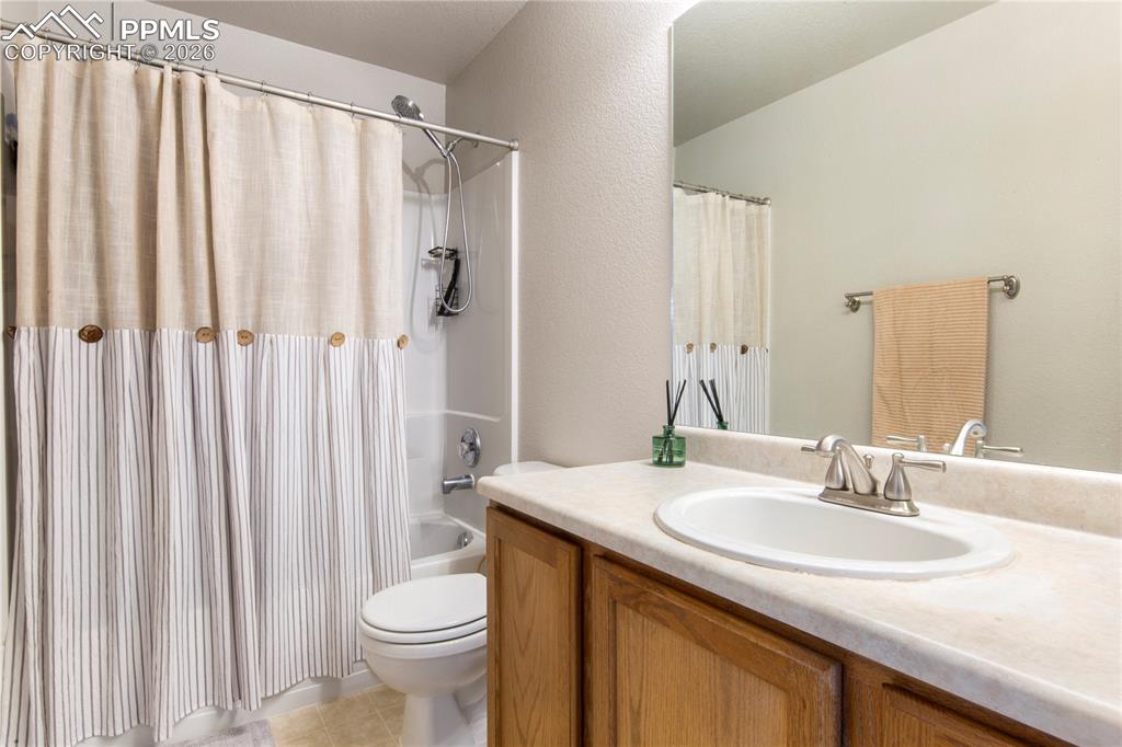 Image 13 of 27: Full bathroom attached to the primary bedroom
