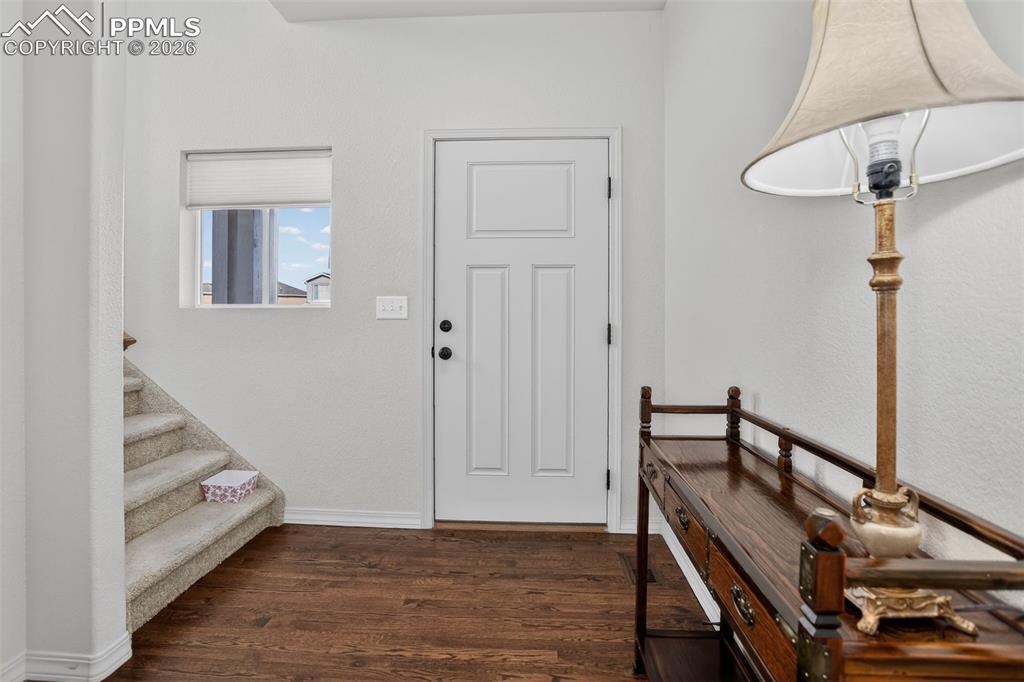 Image 11 of 46: Foyer hardwood welcomes you