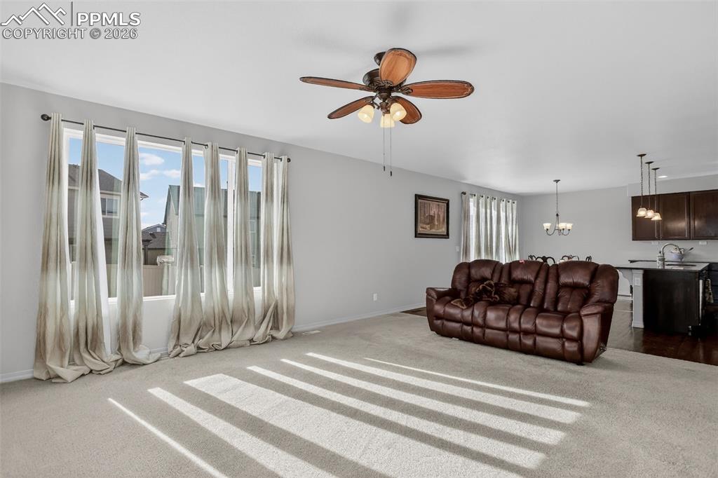Image 21 of 46: Living room offers tons of natural light