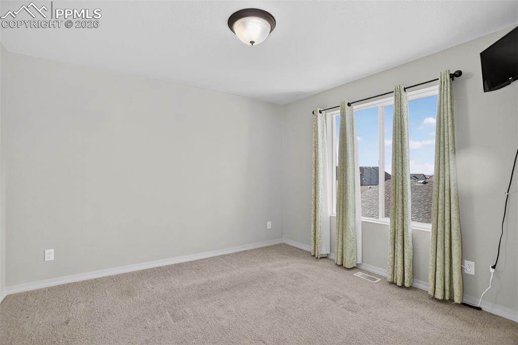 Image 27 of 46: Bedroom 2 provides lots of sunshine