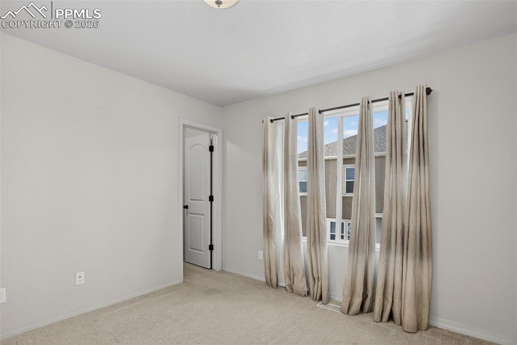 Image 32 of 46: Bedroom 4 walk in closet