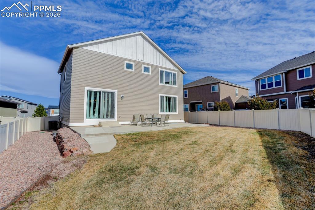 Image 40 of 46: Rear view featuring vinyl fence