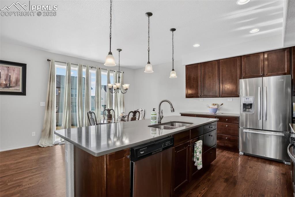 Image 7 of 46: Kitchen features hardwood floors