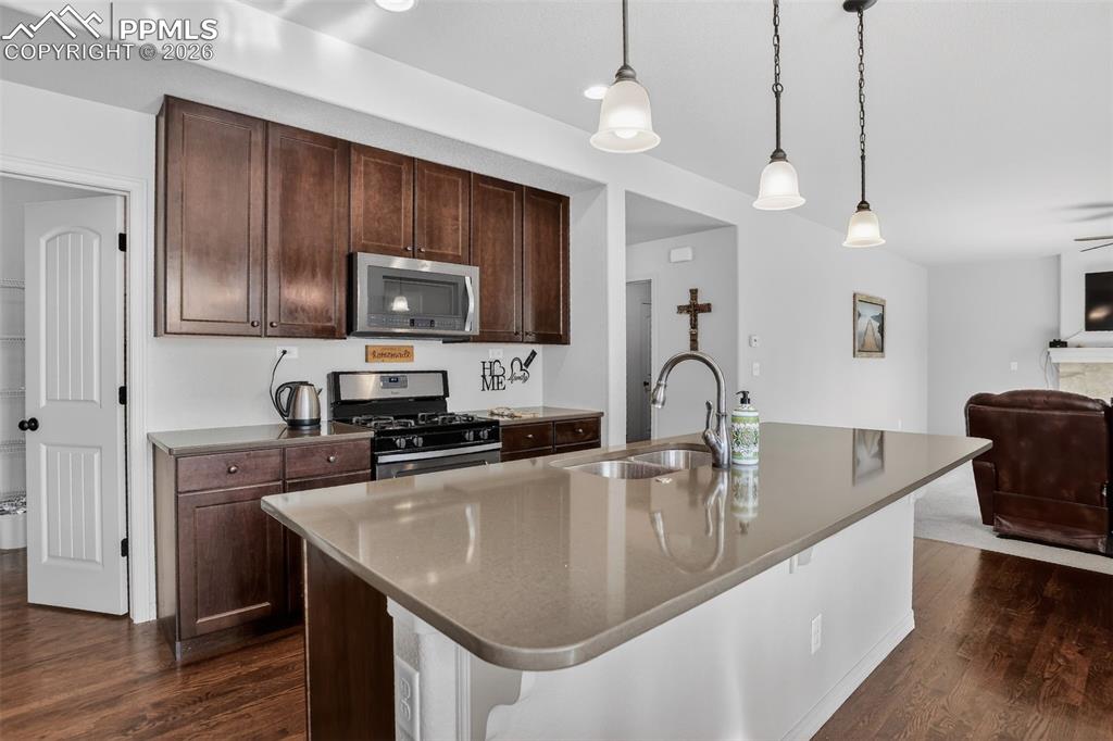 Image 8 of 46: Kitchen offers gas range/oven