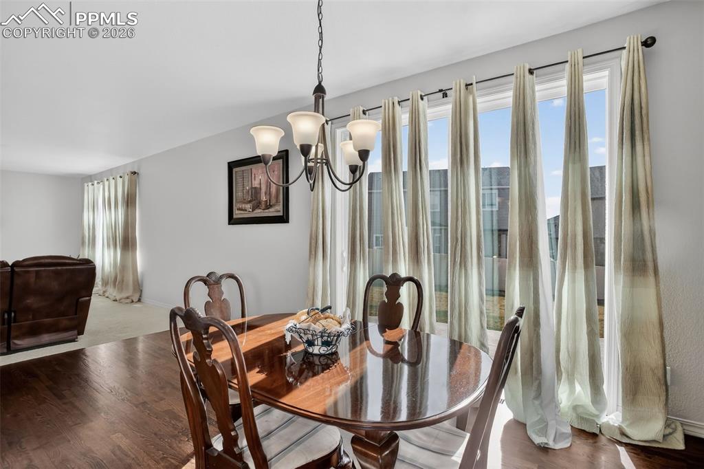 Image 9 of 46: Dining room walks out to patio