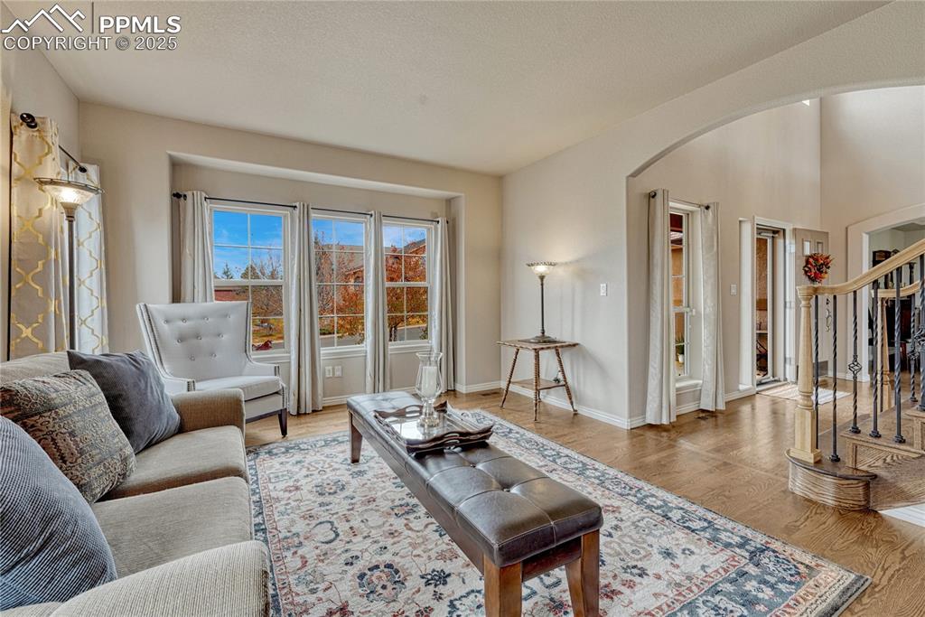 Image 10 of 48: ...an arched entry and hardwood floor.