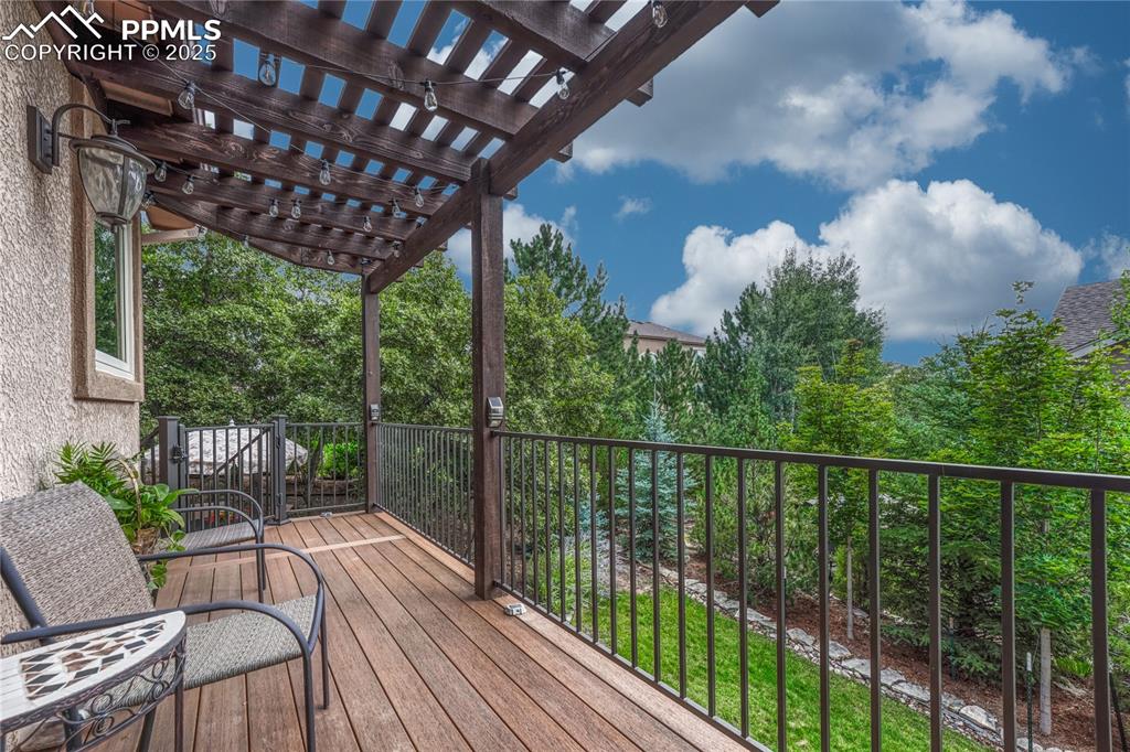 Image 15 of 48: ...to a composite deck with pergola. Imaging morning coffee or watching the