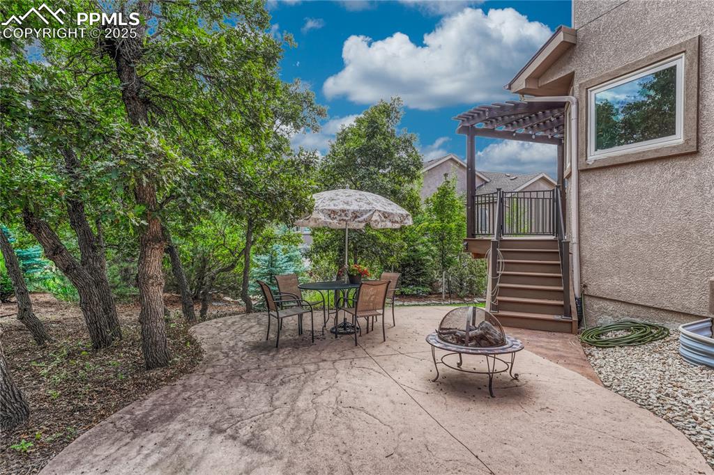 Image 16 of 48: Wonderful entertaining space on this stamped concrete patio accessible from