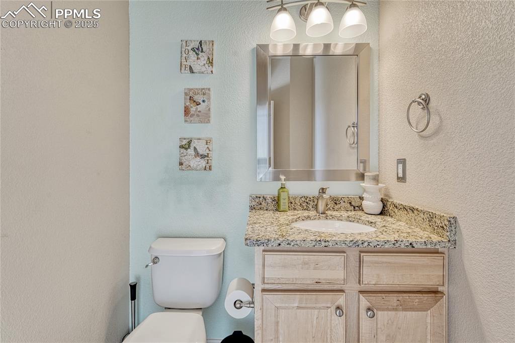 Image 21 of 48: Main level powder room. 