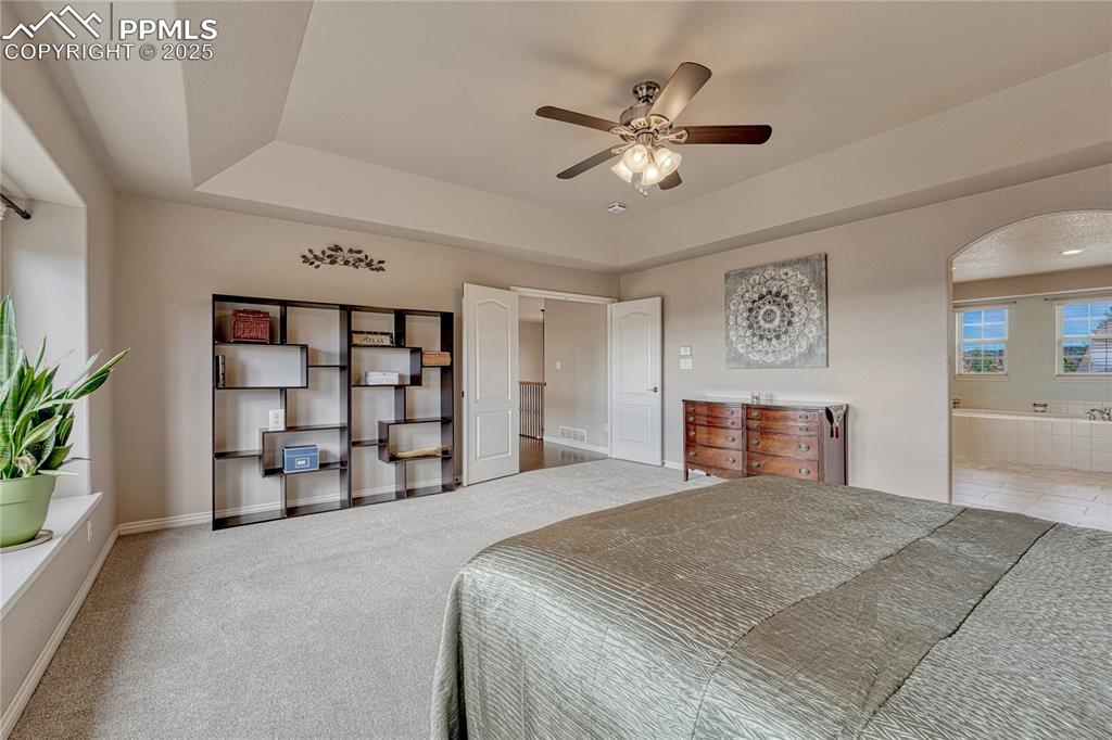 Image 25 of 48: ...ceiling fan, French doors and new carpet. 