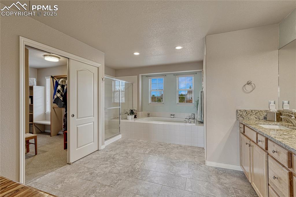 Image 27 of 48: ...soaking tub, tile floors...