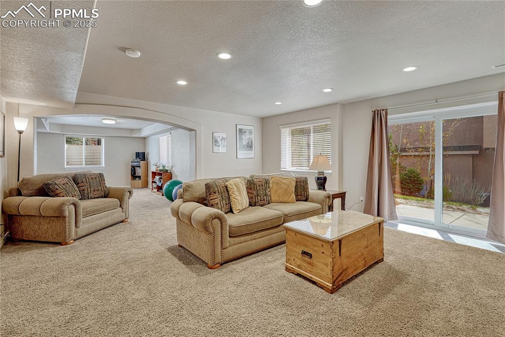 Image 33 of 48: Basement family room with walk-out...