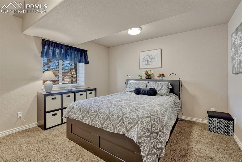 Image 44 of 48: Second of two basement bedrooms with above grade window.