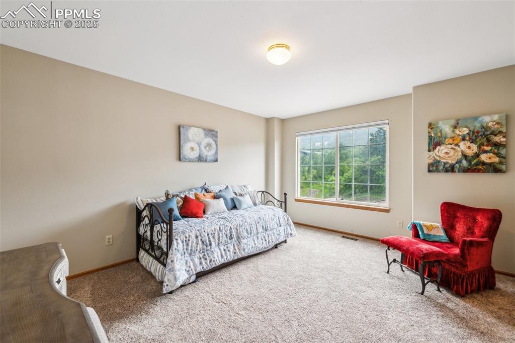 Image 32 of 43: Carpeted bedroom featuring baseboards