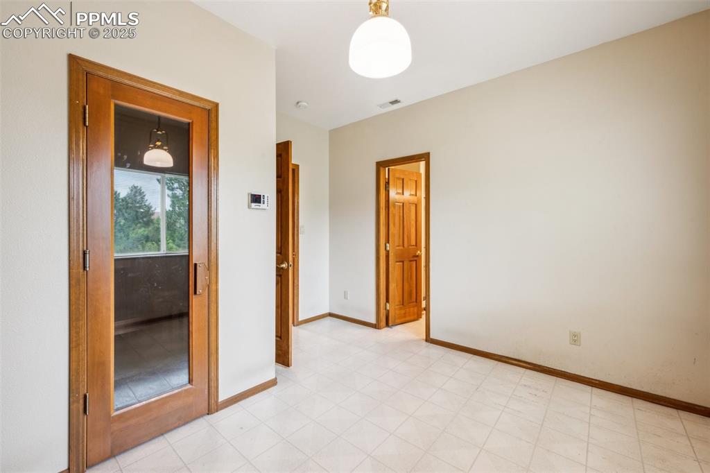 Image 37 of 43: Empty room featuring baseboards and light flooring