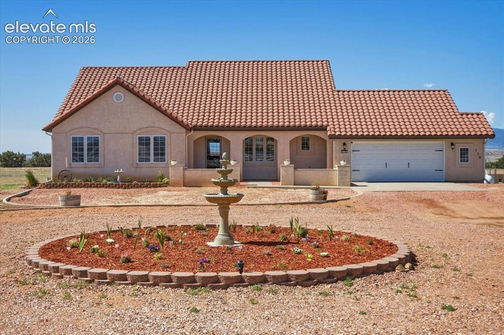 Image 1 of 50: Attractive ranch-style home featuring a tile roof, front court yard, and ci