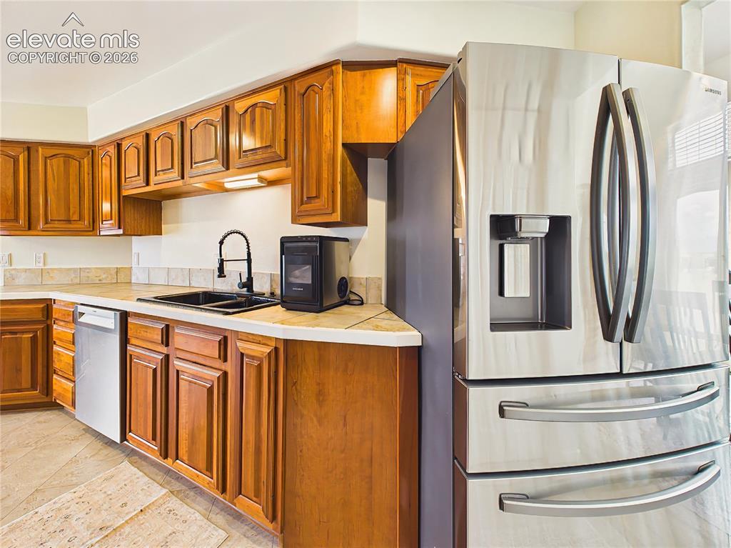 Image 10 of 50: Stainless steel appliances, durable surfaces, and generous cabinetry combin