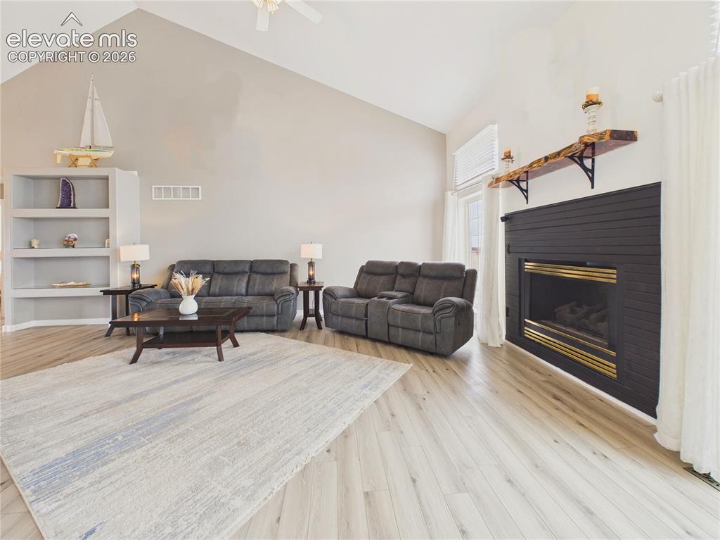 Image 21 of 50: The expansive living room offers plenty of space for relaxing or entertaini
