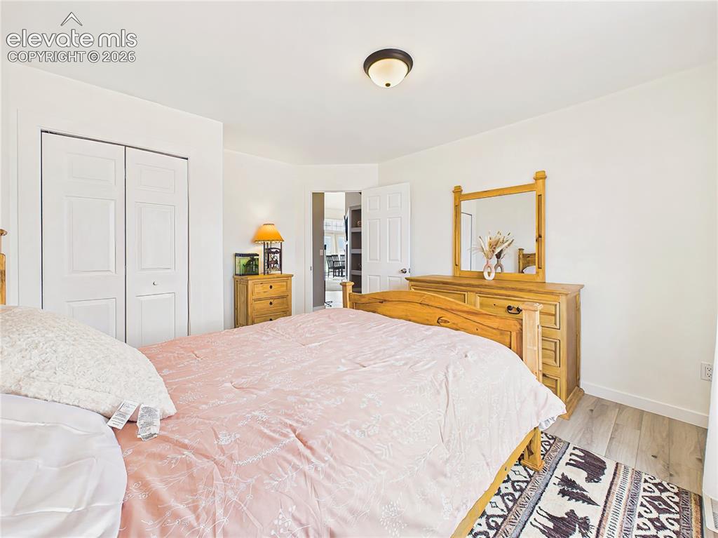 Image 28 of 50: Bright bedroom 2 offers peaceful views of the surrounding property and flex
