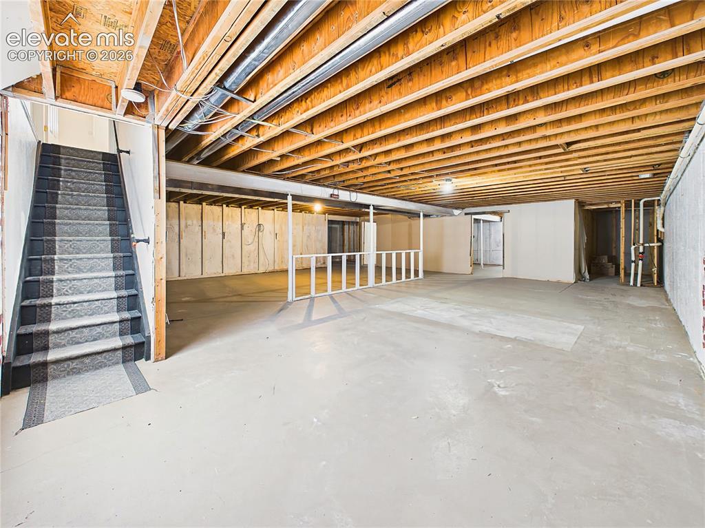 Image 33 of 50: Full unfinished basement offers exceptional square footage and potential fo
