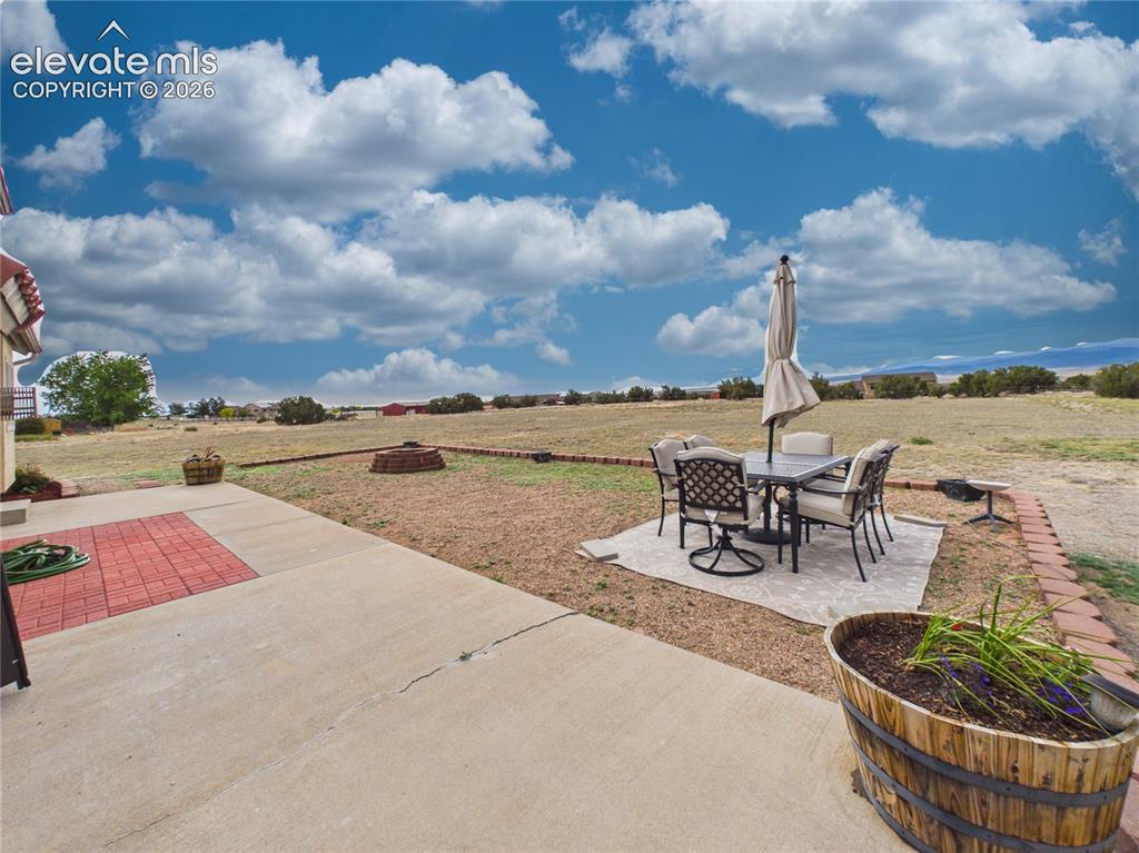 Image 45 of 50: Dedicated seating area offers a peaceful place to unwind while enjoying wid