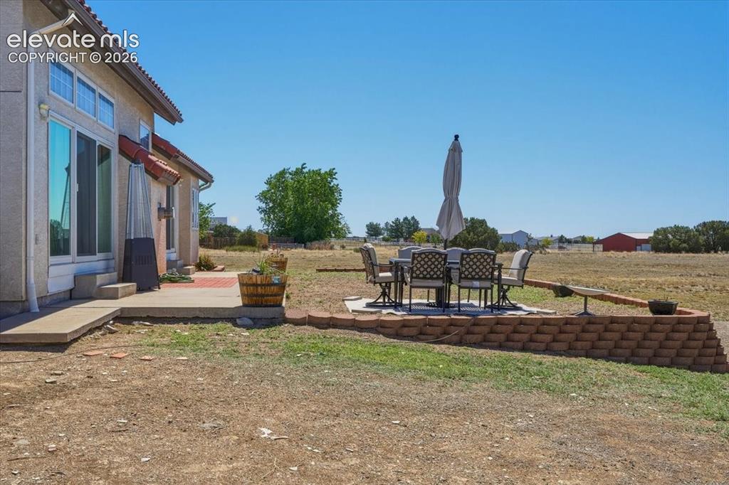 Image 46 of 50: Dedicated outdoor seating area positioned to capture beautiful mountain vie