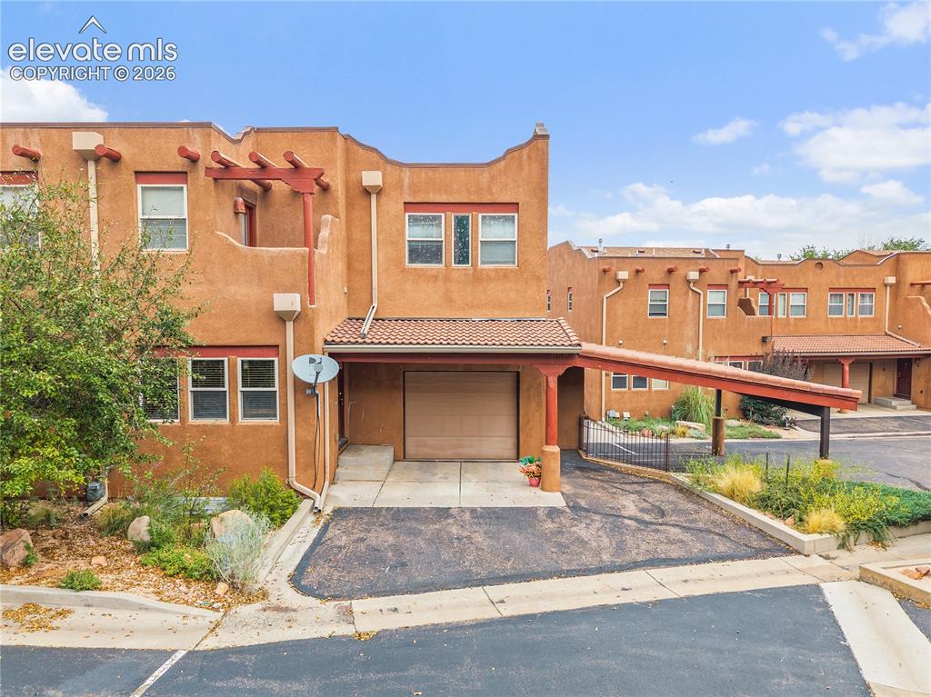 Caption: One car garage and maintenance free living. 