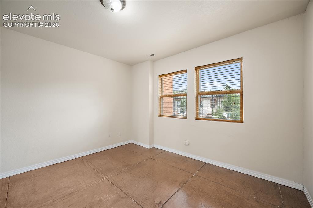 Image 29 of 40: Basement bedroom with walk in closet and pool view.