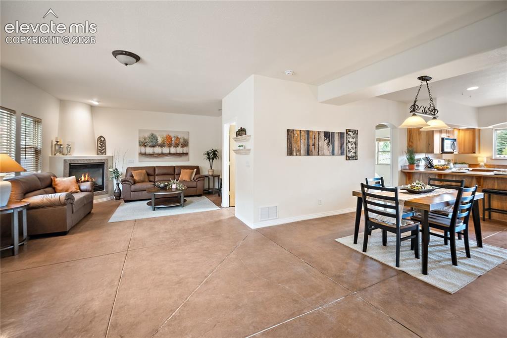 Image 4 of 40: Spacious open concept living, dining and kitchen.
