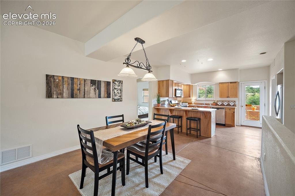Image 8 of 40: Dining room open to the kitchen and perfect for entertaining.