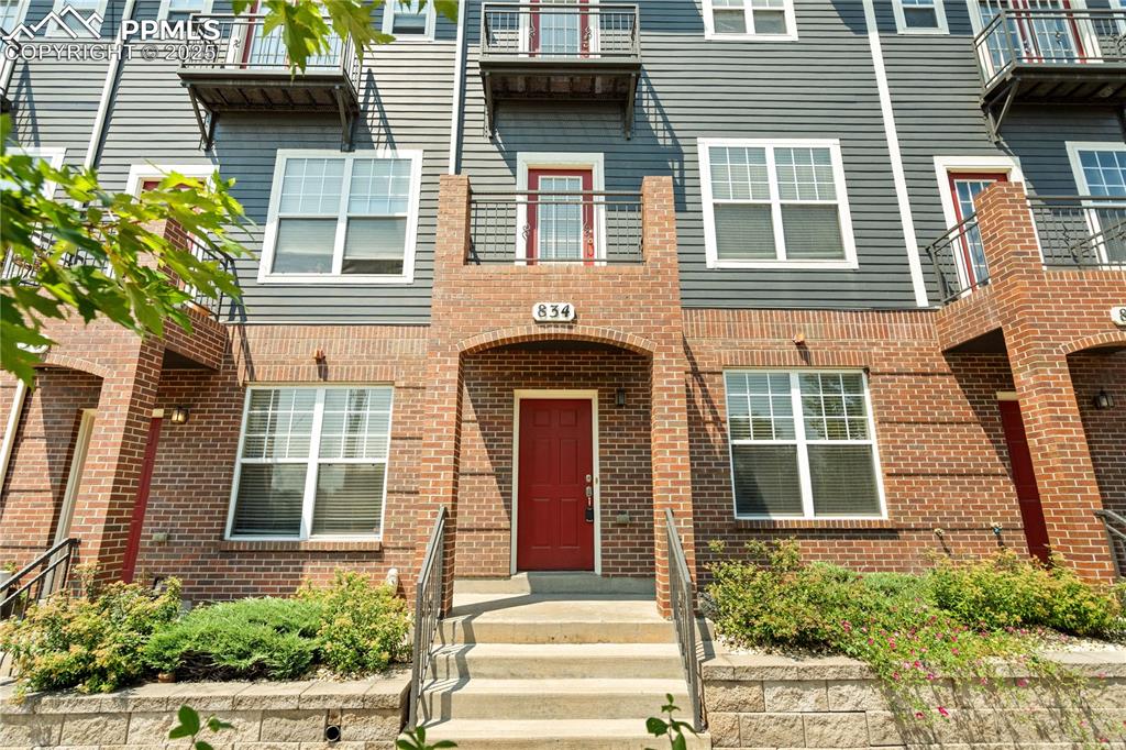 Caption: Distinctive curb appeal and a vibrant entry define this centrally located Colorado Springs downtown 