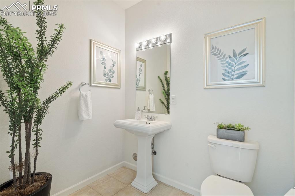 Image 10 of 43: 1/2 bath on the main level by the flex room.