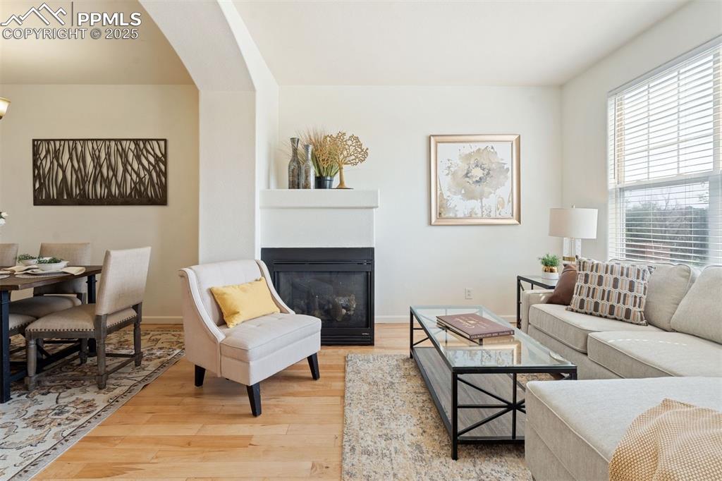 Image 12 of 43: The living room resides on the first upper level above the flex room - the