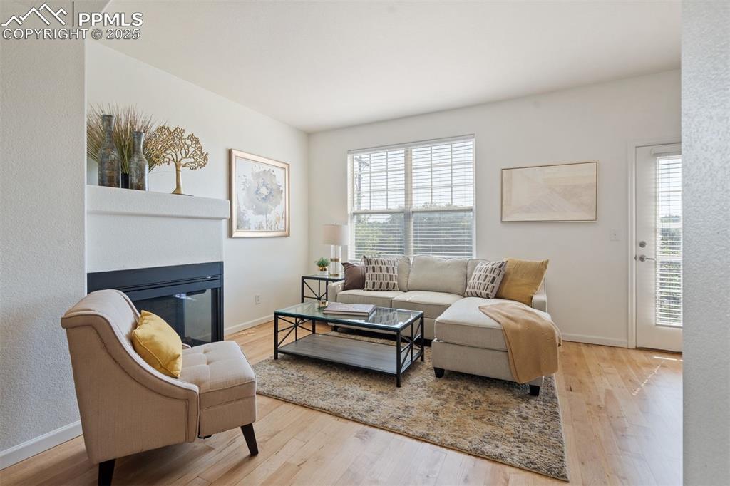 Image 3 of 43: Elegant and inviting - this refined living space features a gas fireplace a