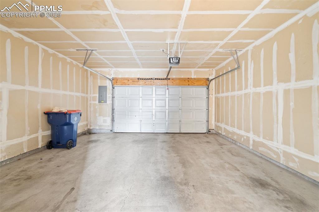 Image 36 of 43: The 2-car garage has connects to the unit and has water.