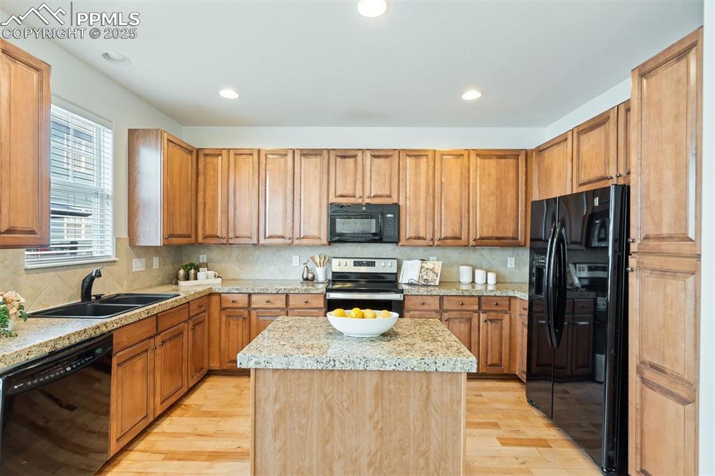 Image 5 of 43: Designed for function and flow, this granite-tiled kitchen features upgrade