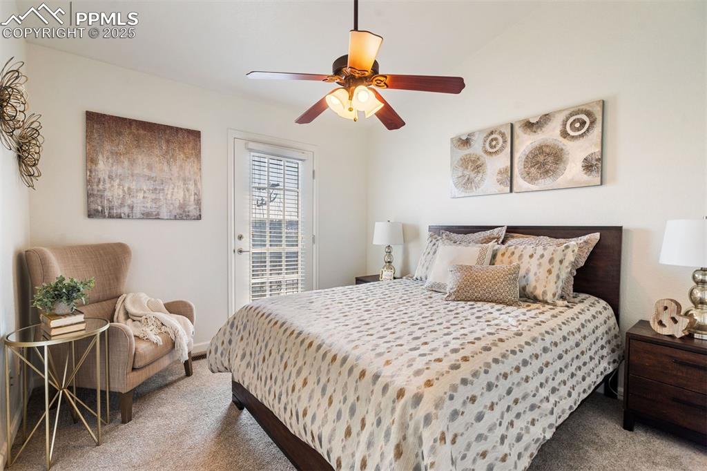 Image 7 of 43: Spacious primary suite with private balcony access, plush carpet, and abund