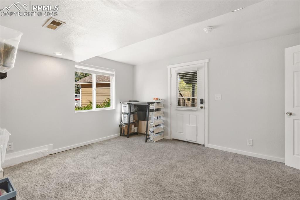 Image 19 of 33: Basement bedroom