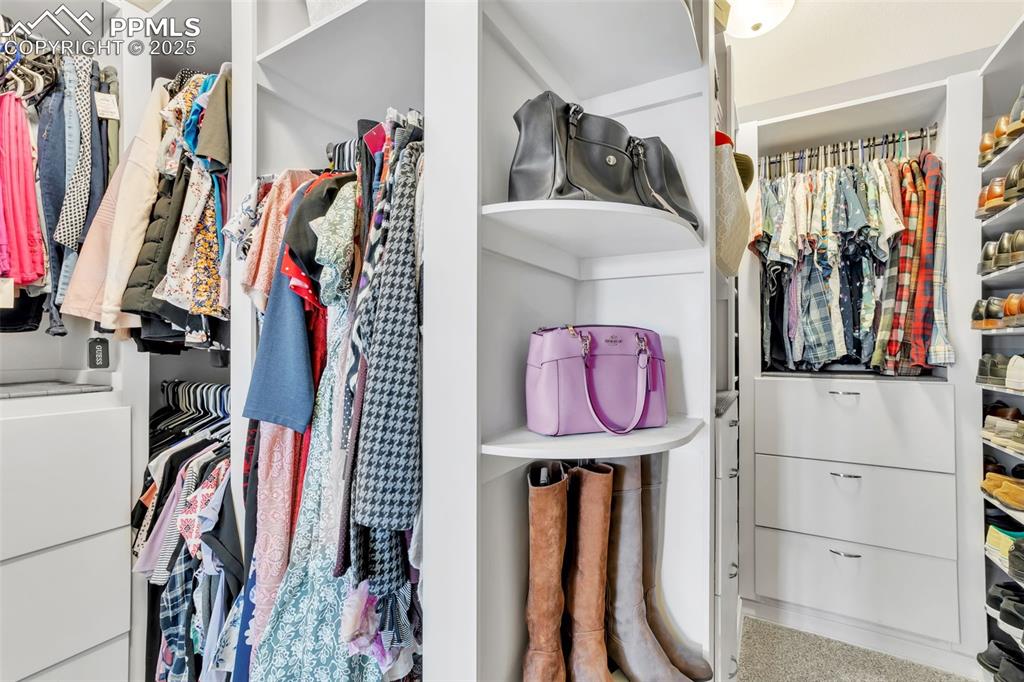 Image 22 of 50: Primary closet with upgraded finishes.