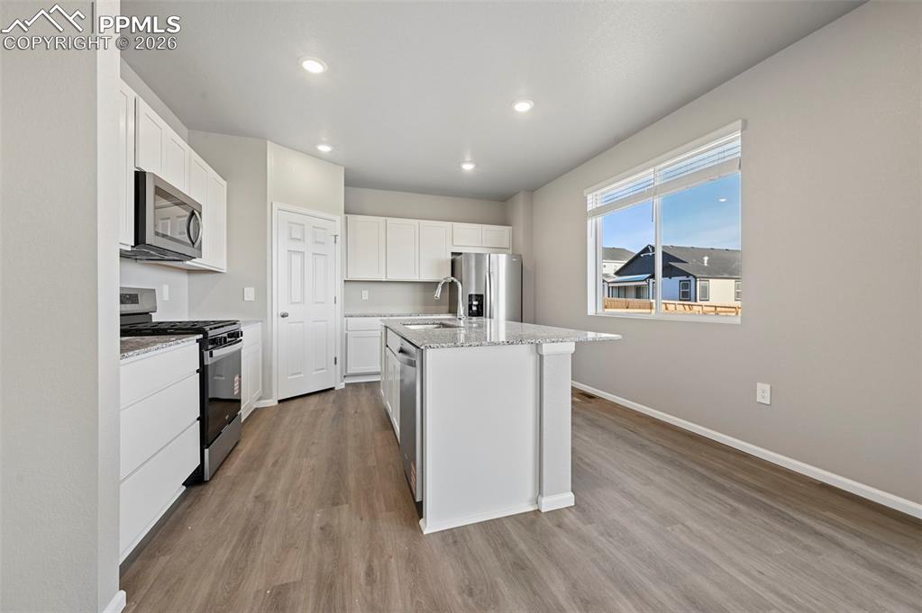 Image 10 of 39: Gorgeous kitchen with stainless steel appliances and granite countertops