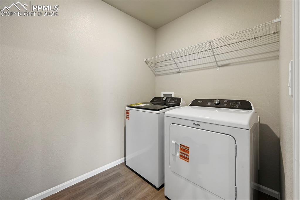 Image 17 of 39: Upstairs laundry with washer and dryer appliance package included!  