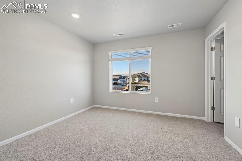 Image 25 of 39: Unstaged bedroom