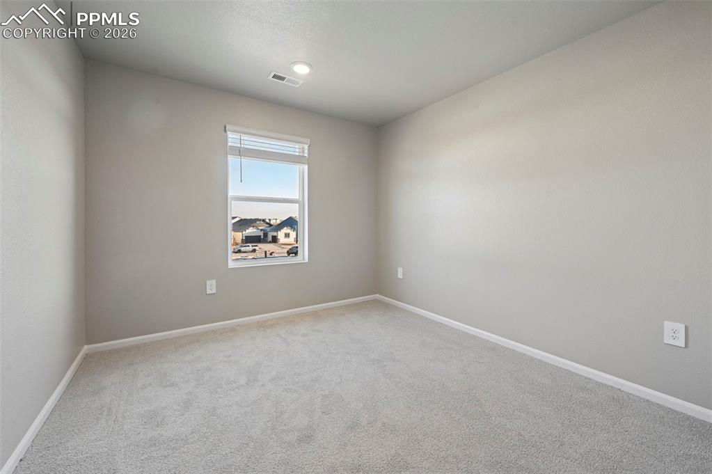 Image 28 of 39: Unstaged bedroom