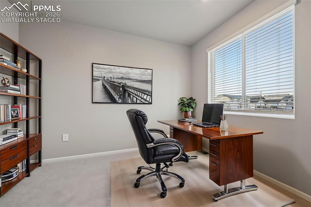 Image 3 of 39: Virtually staged flex room serves as dedicated office, formal dining, or ad