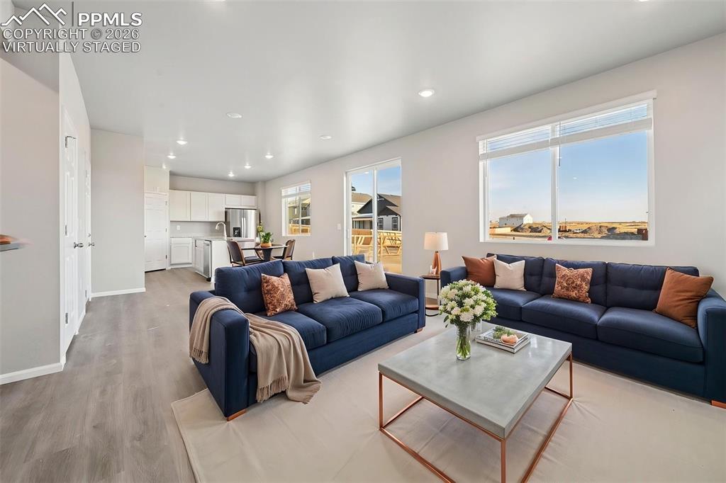 Image 6 of 39: Virtually Staged living room, large open concept main floor 