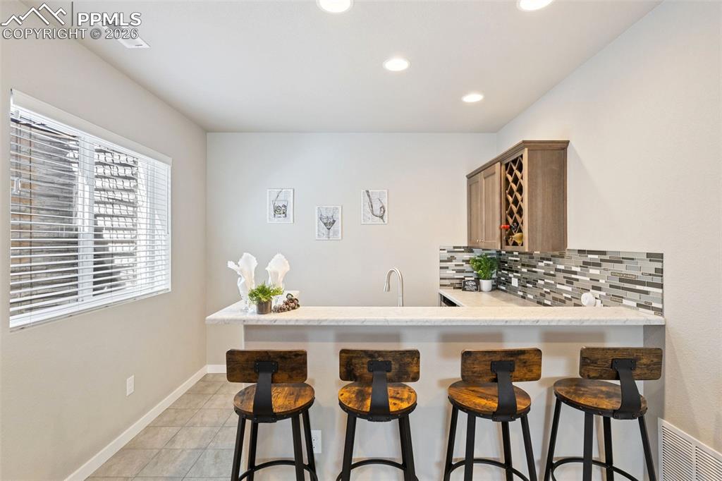 Image 24 of 46: Designer wet bar for all the occasions