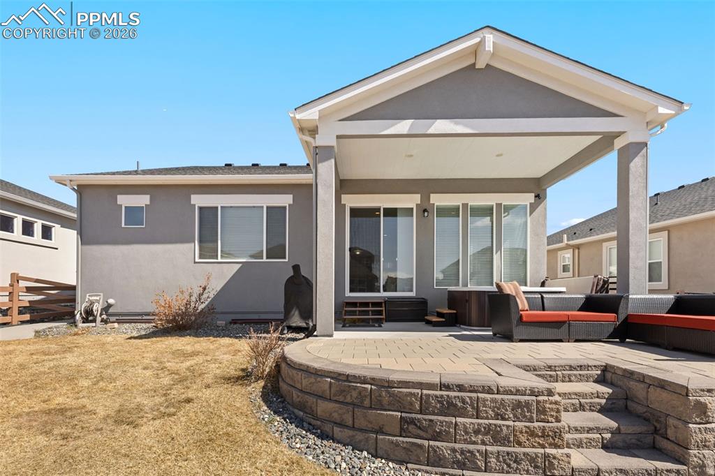 Image 32 of 46: Backyard with covered patio