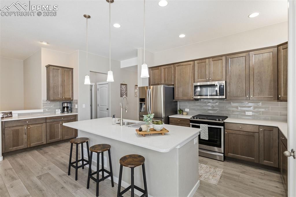 Image 6 of 46: Huge island with coffee station to the left