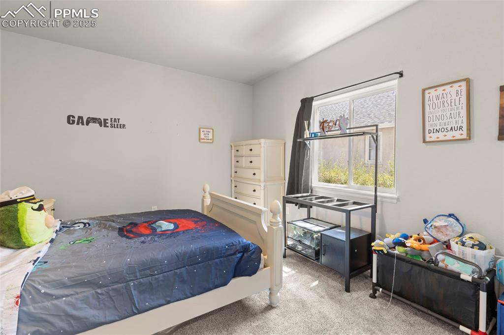 Image 19 of 23: Bedroom with carpet